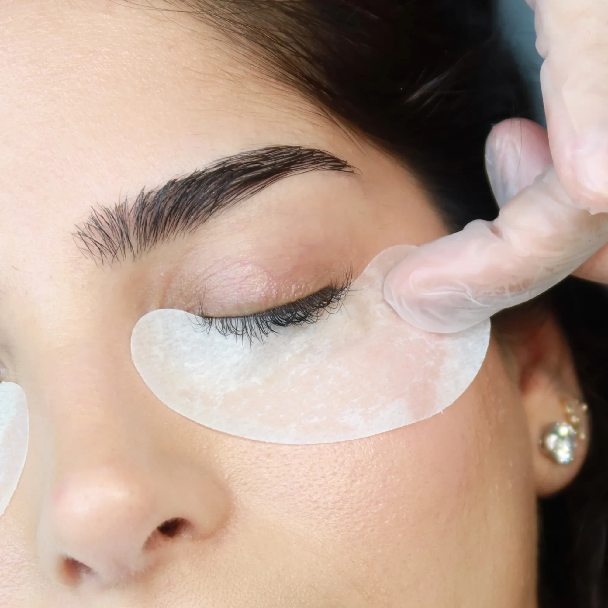 AZIZAM technician preparing a client for a lash lift in Dubai