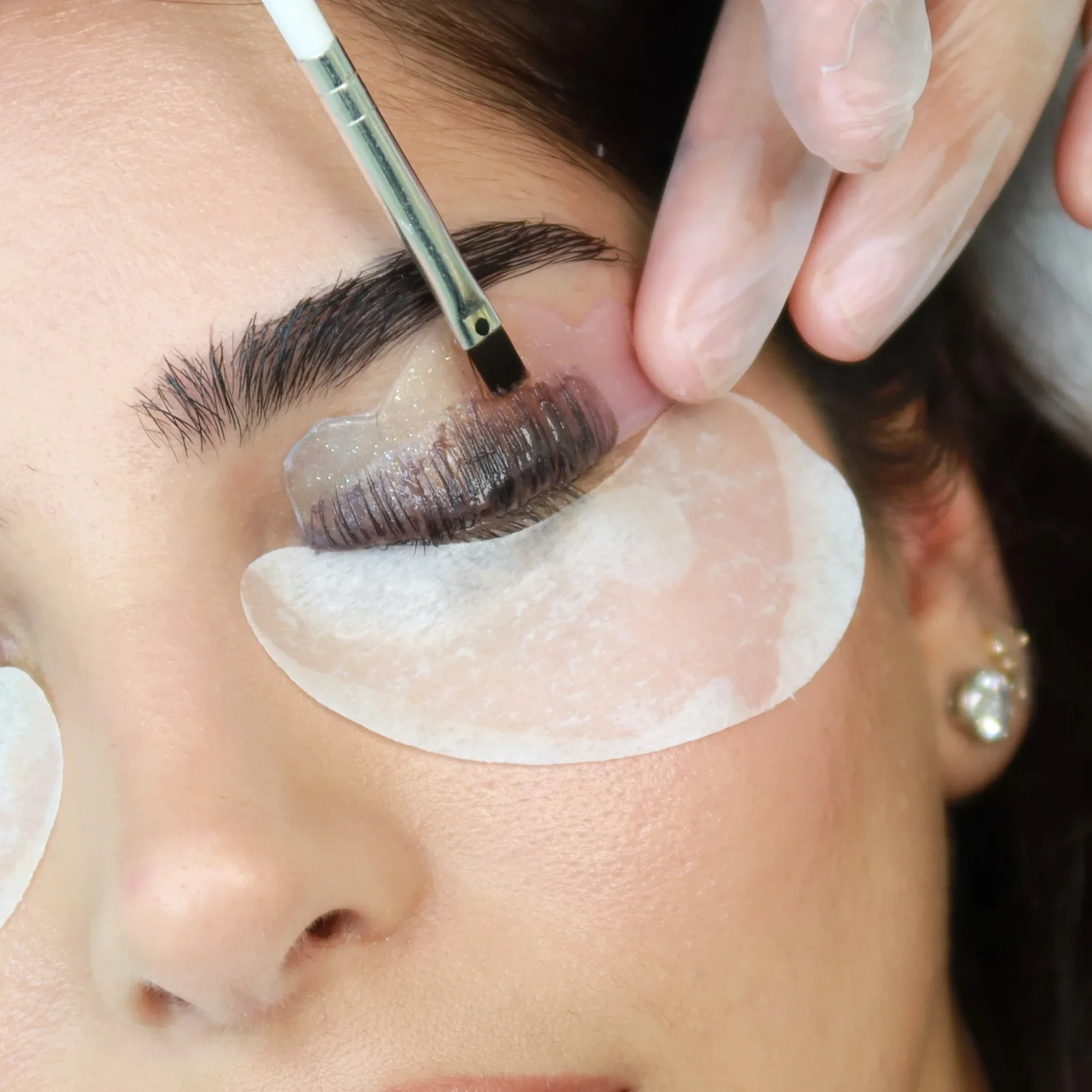 Lash tint brushed through lifted natural lashes at AZIZAM beauty salon in Dubai