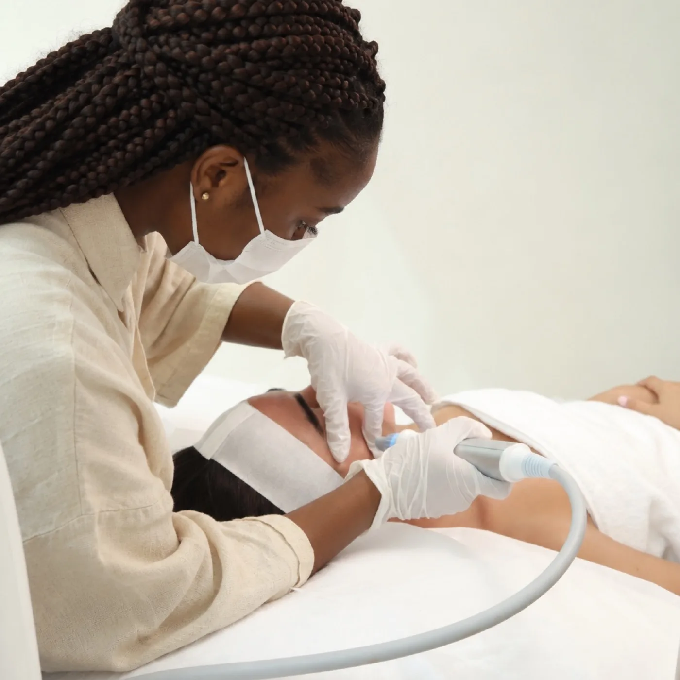 Cleansing facial in Dubai, serums applied to hydrate the skin at AZIZAM beauty salon